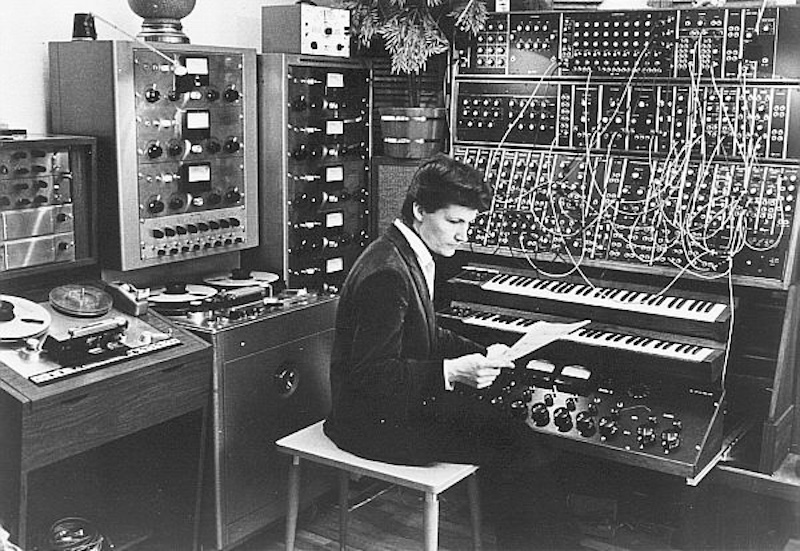 Walter (later Wendy) Carlos at work in the studio with Ampex multi-track tape machine, Moog Synthesizer and custom mixer, circa 1960s. Photo Peter Forrest, Bridgeman Images