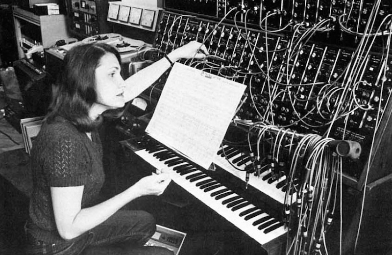 Wendy Carlos studying Tron score at her modular Moog system, circa 1968. Photo Unknown, Transas City Photographs